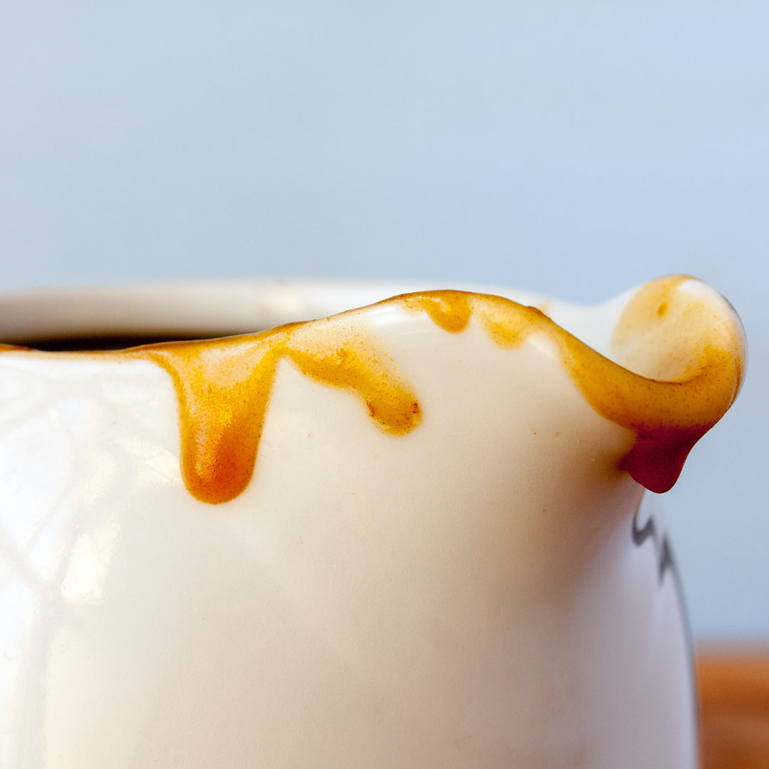 Vegetarian jus in a white ceramic jug