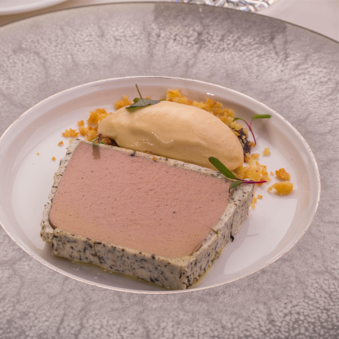 Chicken liver parfait slice with a quenelle of smooth brown cream