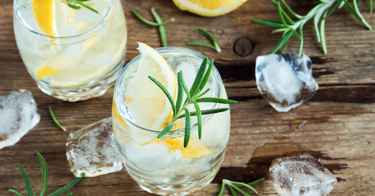 Vermouth and tonic served in a tumbler with plenty of ice, fresh rosemary sprig and lemon wedge