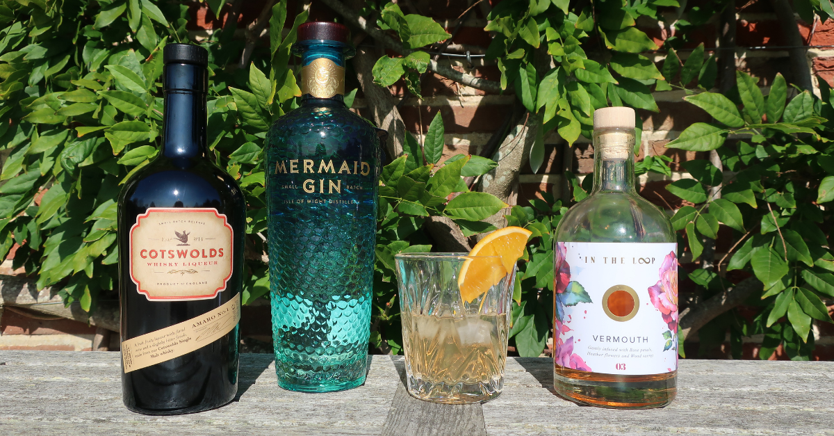 Lineup of Cotswold distillery whisky amaro, mermaid gin and in the loop vermouth