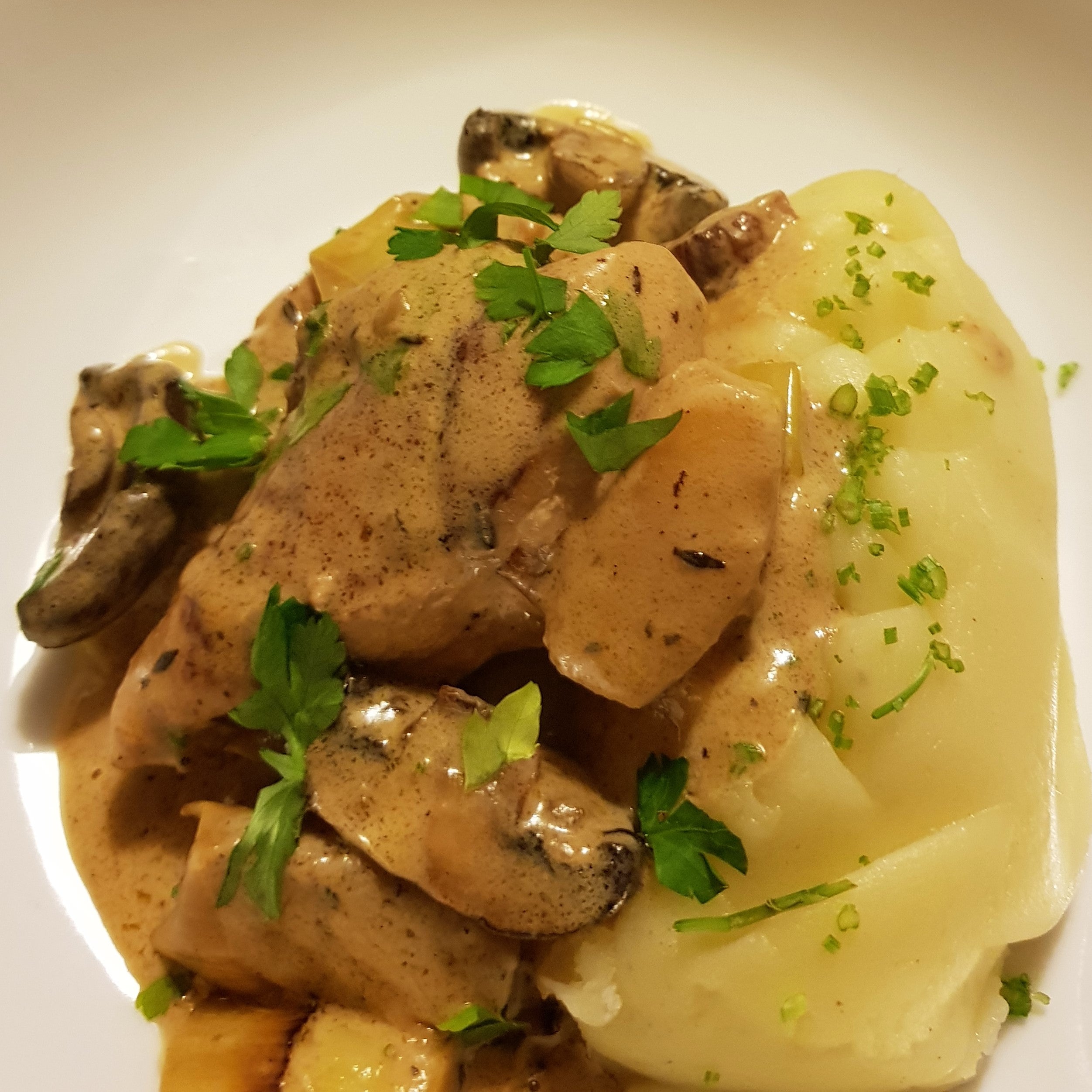 Normandy chicken and mash with fresh chopped parsley