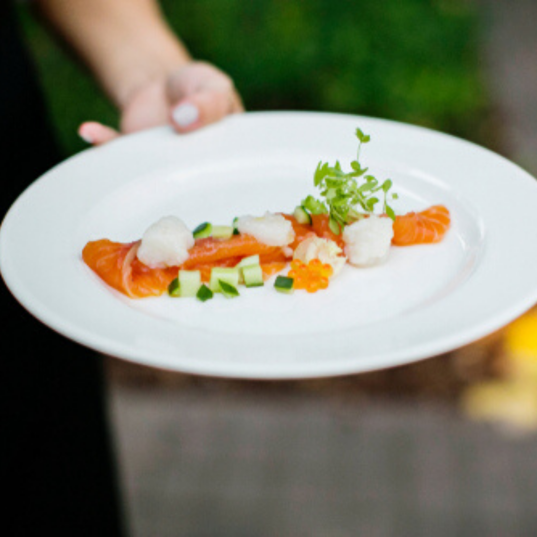 Salmon and scallop ceviche on a clean white plate